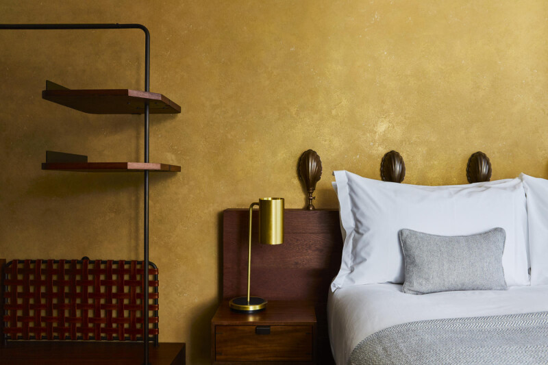 Viero UK venetian plaster in gold within a London Hotel bedroom.