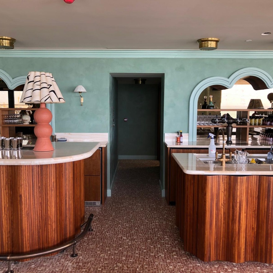 Soho House bar detail with Veneto Venetian plaster in soft pastel green, showcasing Viero UK's smooth, luxury finish