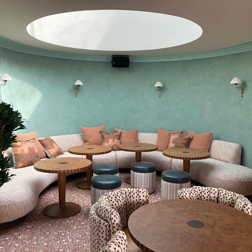 Elegant light green tones of Veneto Venetian plaster highlight the wall texture in Soho House's modern break-out area.